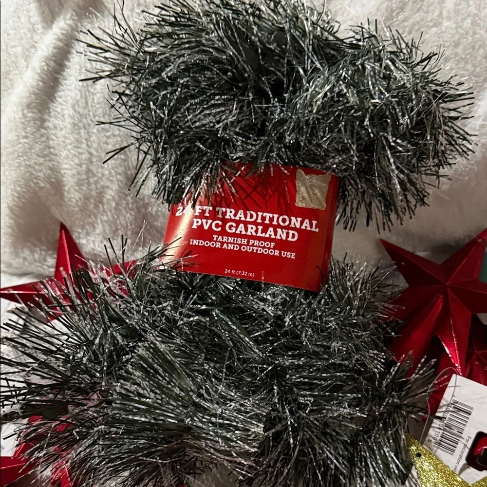 Festive Red and Gold Star Garland with Green Foliage